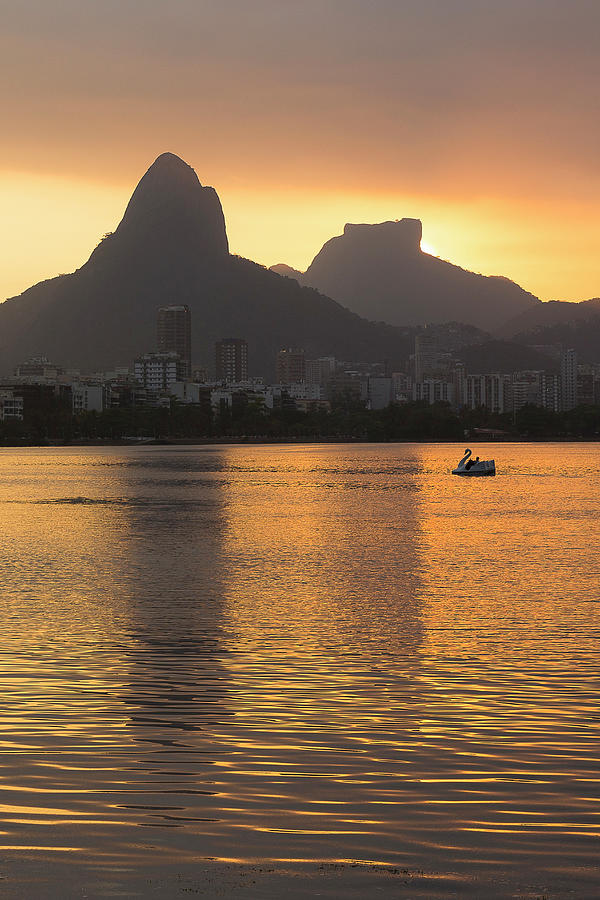 Rodrigo de Freitas Lagoon at sunset with Two Brothers Mountain reflected in the water