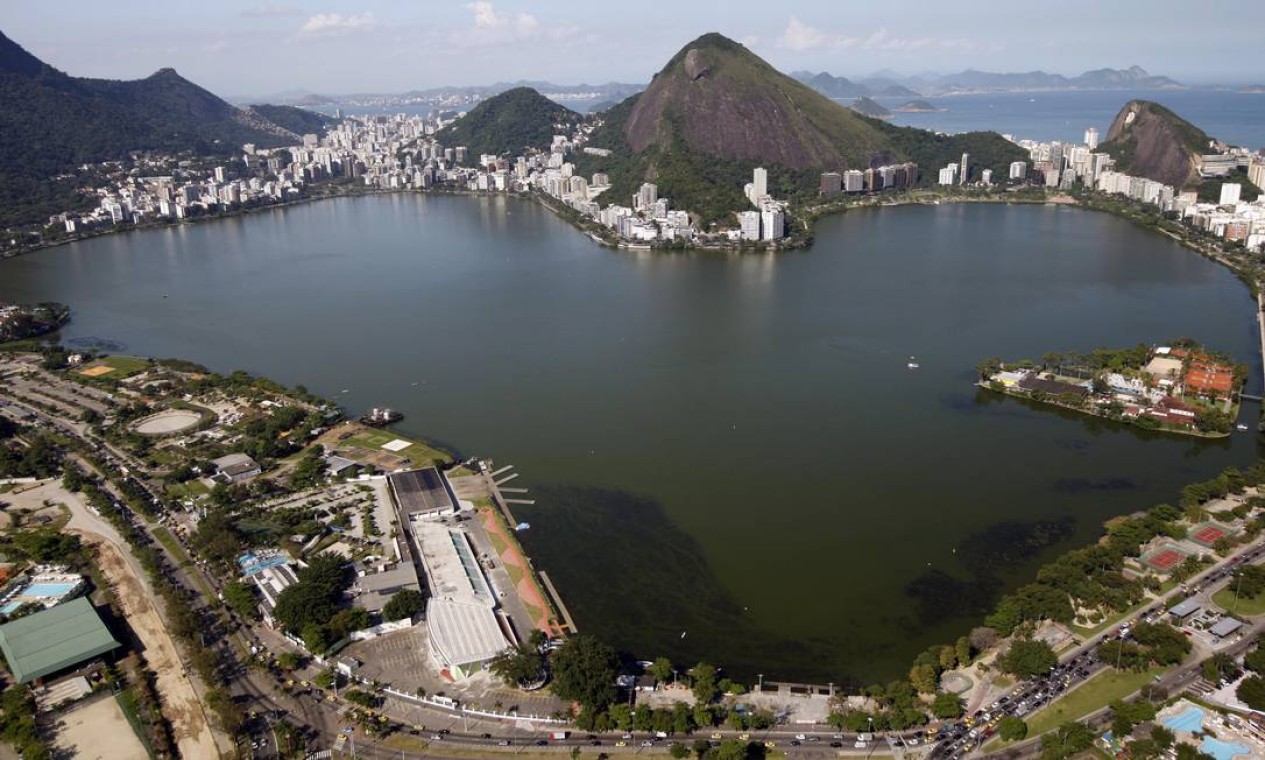Rodrigo de Freitas Lagoon at sunset with Two Brothers Mountain reflected in calm water