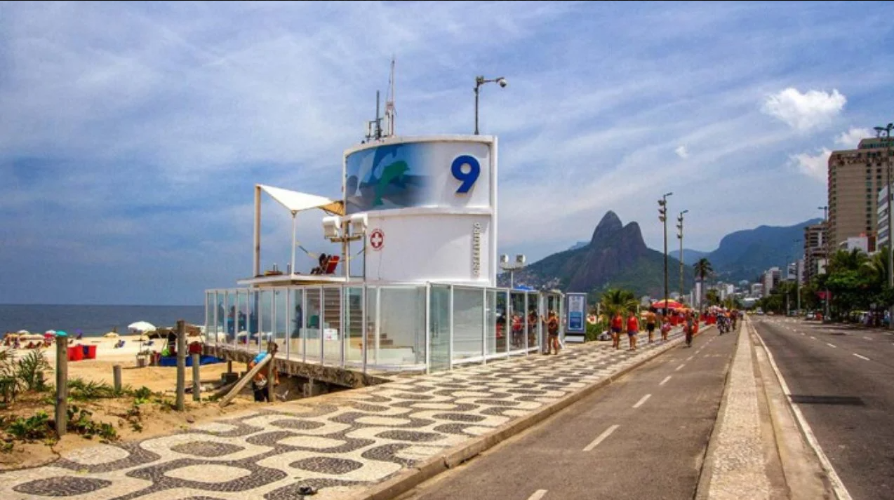 Posto 9 — the legendary beach stretch of Ipanema with blue water, golden sand, and Rio's iconic lifeguard towers