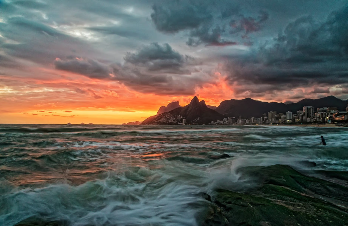 Spectacular sunset at Arpoador Rock with panoramic ocean views